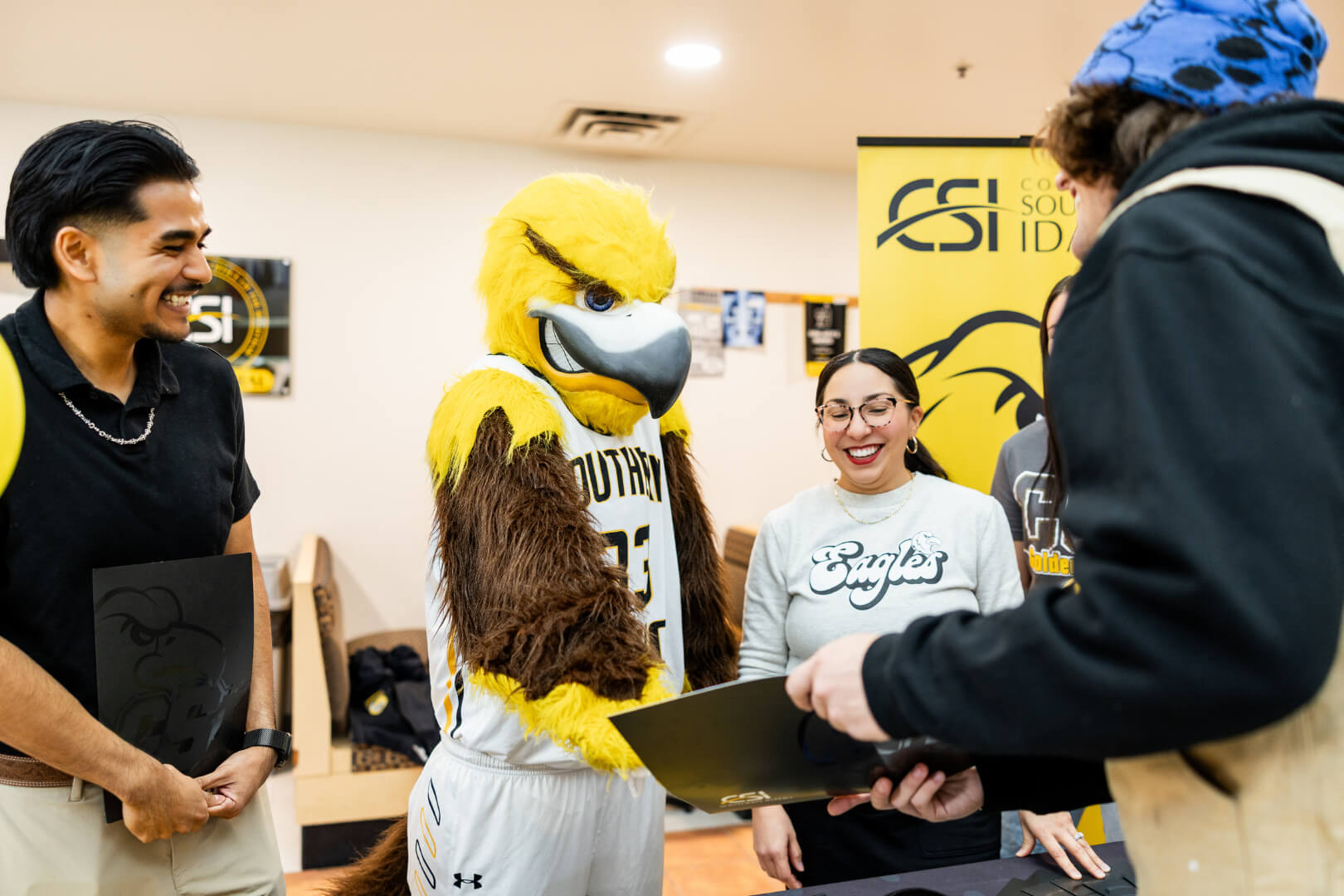 a check-in booth with enrollment specialists on hand to answer questions