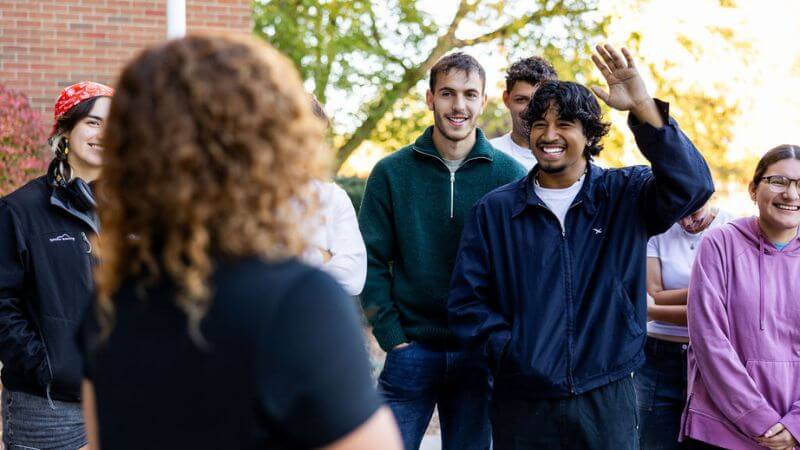 students listening to tour guide