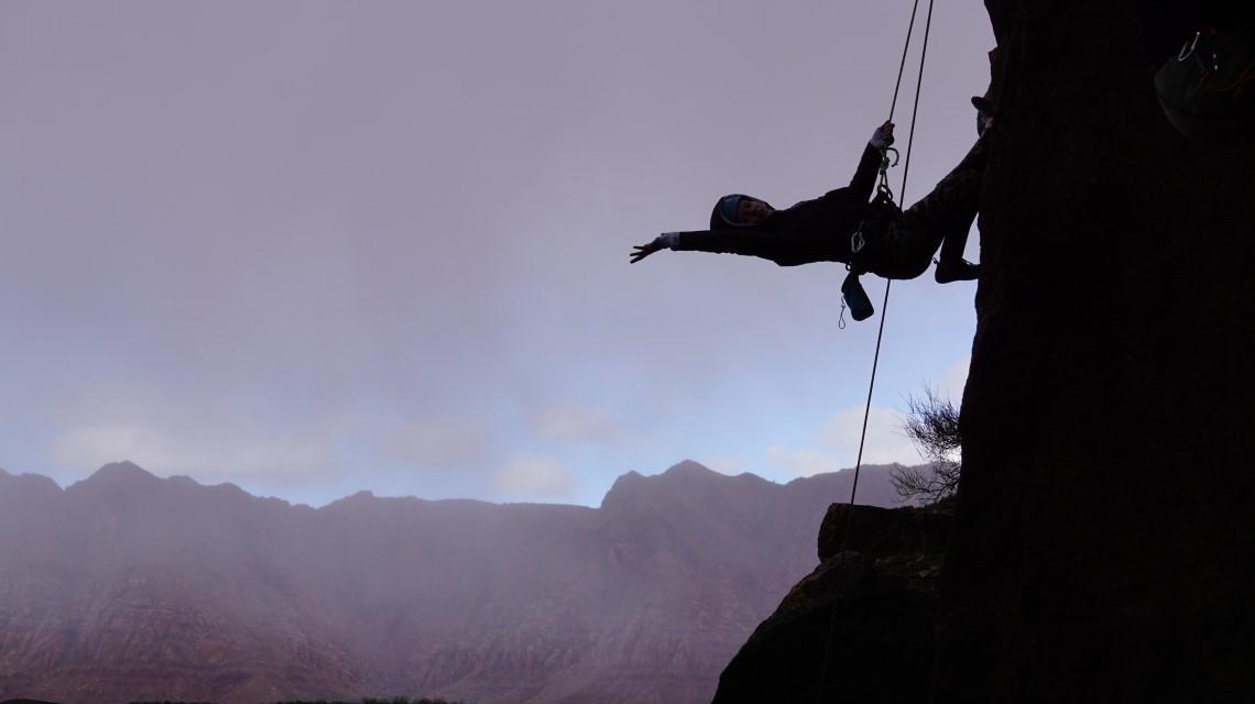 student rappelling 