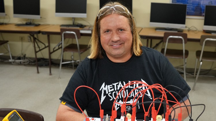 A man sitting in a computer lab