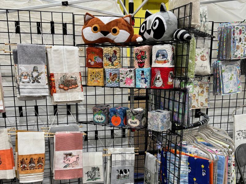 custom embroidered towels and stuffed animals on display