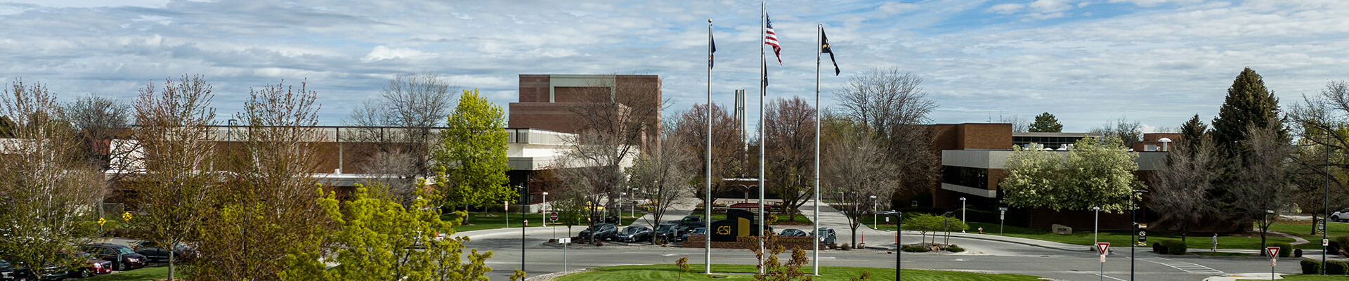 CSI street entrance lined with trees