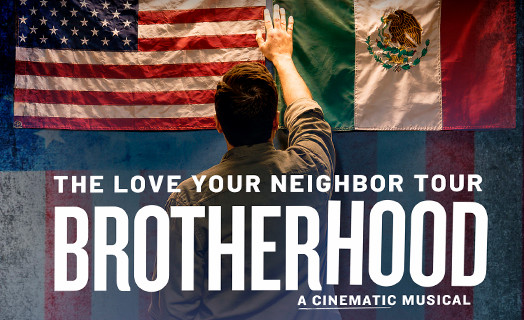 The love your neighbor tour Brotherhood A Cinematic Music, Man standing in front of american flag and mexican flag placing hand on both of them. 