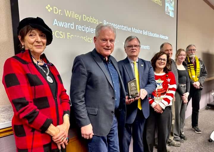 Dr. Wiley Dobbs accepting an award