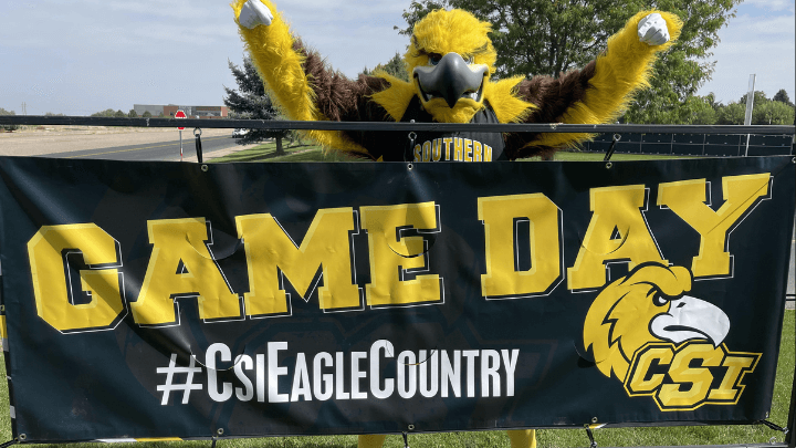 gilbert mascot with a sign saying game day