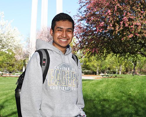 Ethan Espinoza smiling while getting his photo taken