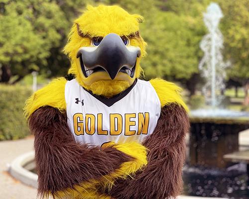 Gilbert standing in front of the CSI fountain