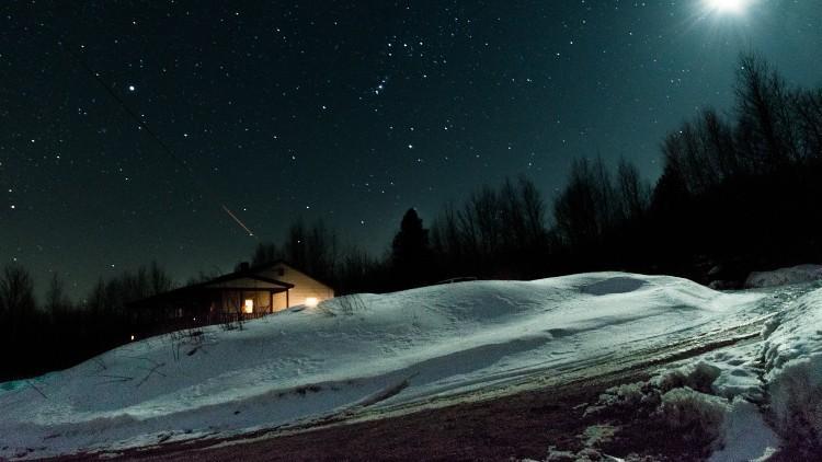 Photo of snowy town at night