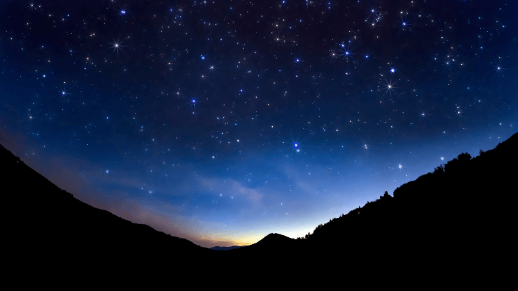 Image of the night sky above a mountain range