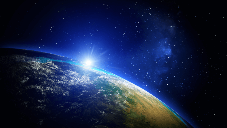 Image of the curve of the earth with the sun coming up