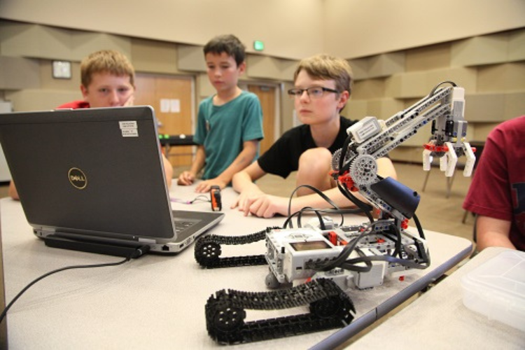 Image of students programming robots.